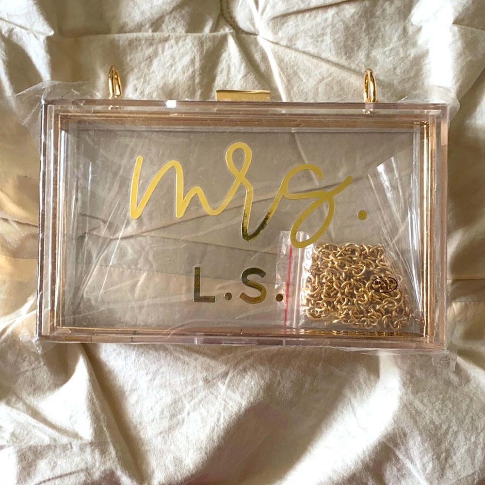 Mrs. L.S. Clear purse.